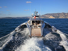 Motor trimaran blue coast 174 Galaxy - rear view while sailing full speed